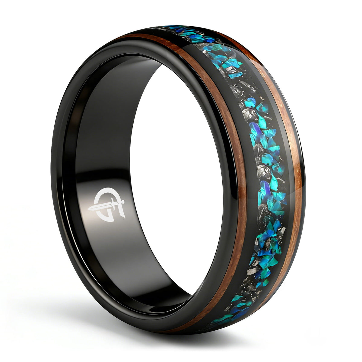 Black domed ring with two wood strips framing a center inlay of silver-gray and blue-green fragments.