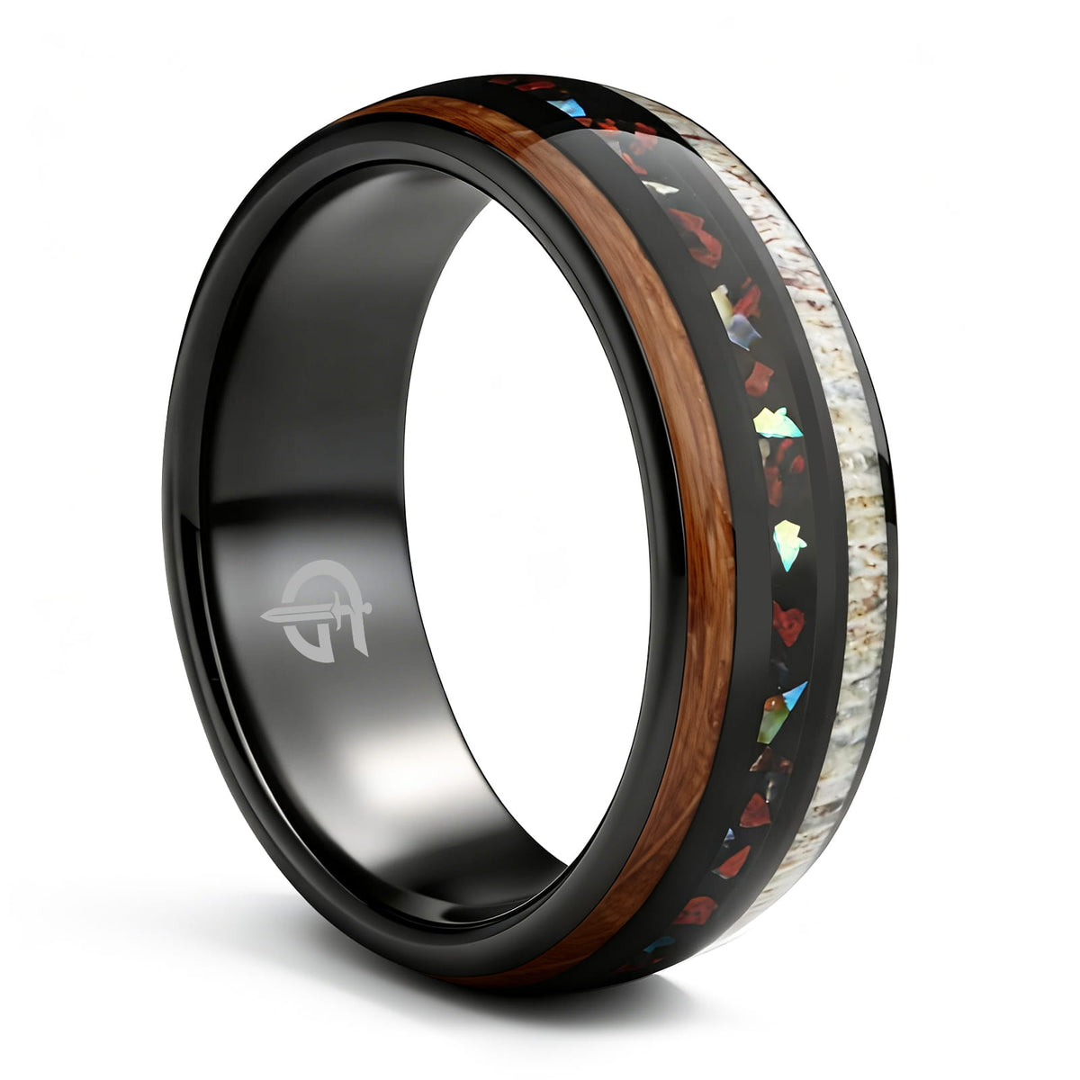 Black tungsten ring with wood and pale antler framing red dinosaur bone and iridescent abalone shell