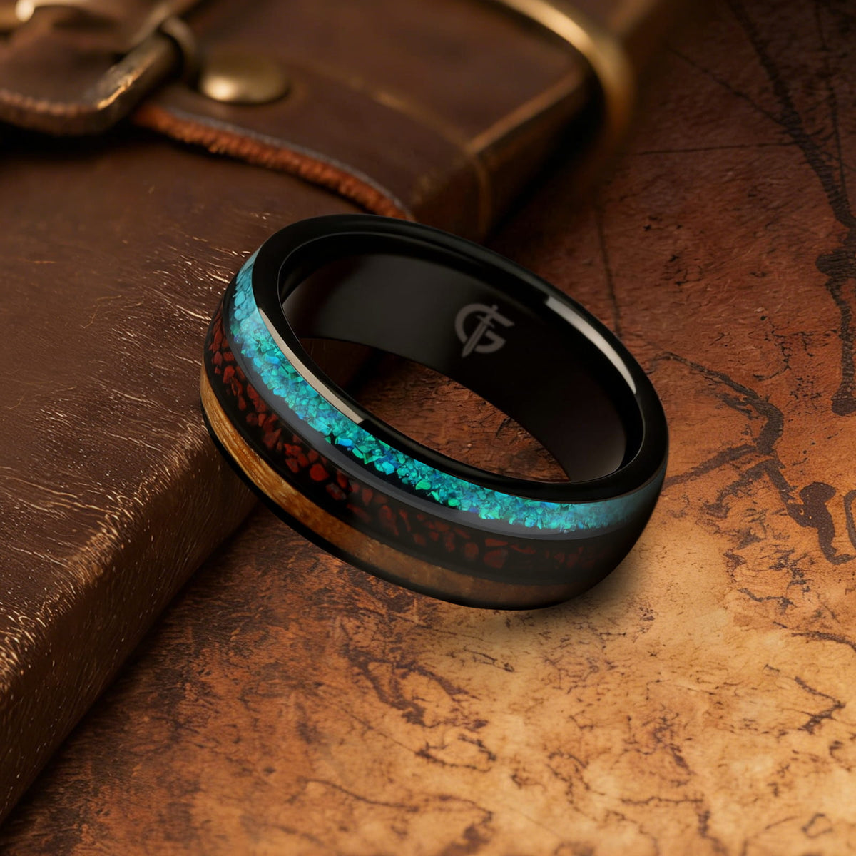 Polished black tungsten ring with brown wood, red dinosaur bone and blue-green turquoise in three bands