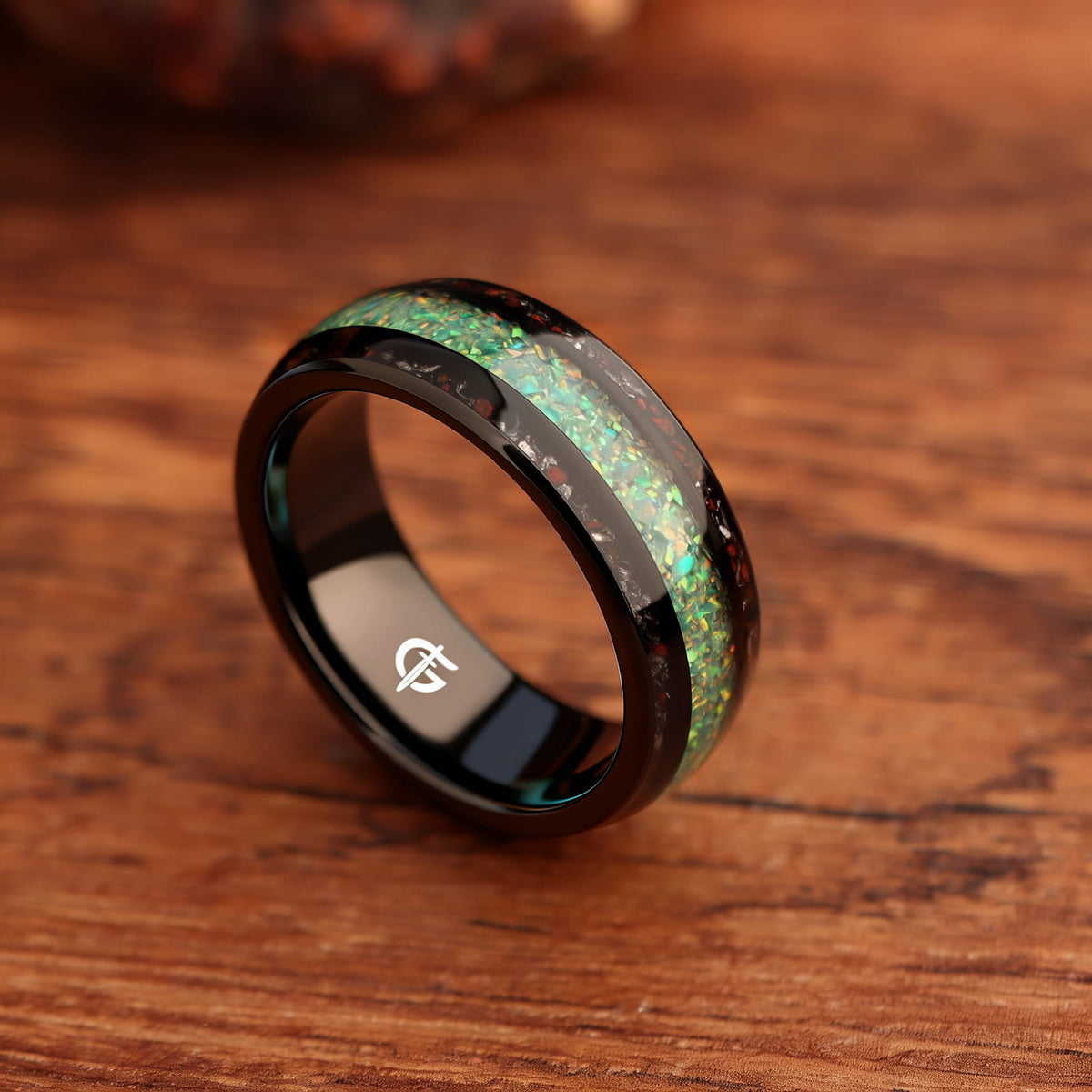 Black tungsten ring with green-yellow natural opal center and red and silver-gray inlays on both sides