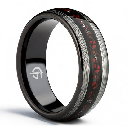 Black tungsten ring with silver-tone fishing line flanking a red dinosaur bone and silver-gray meteorite center